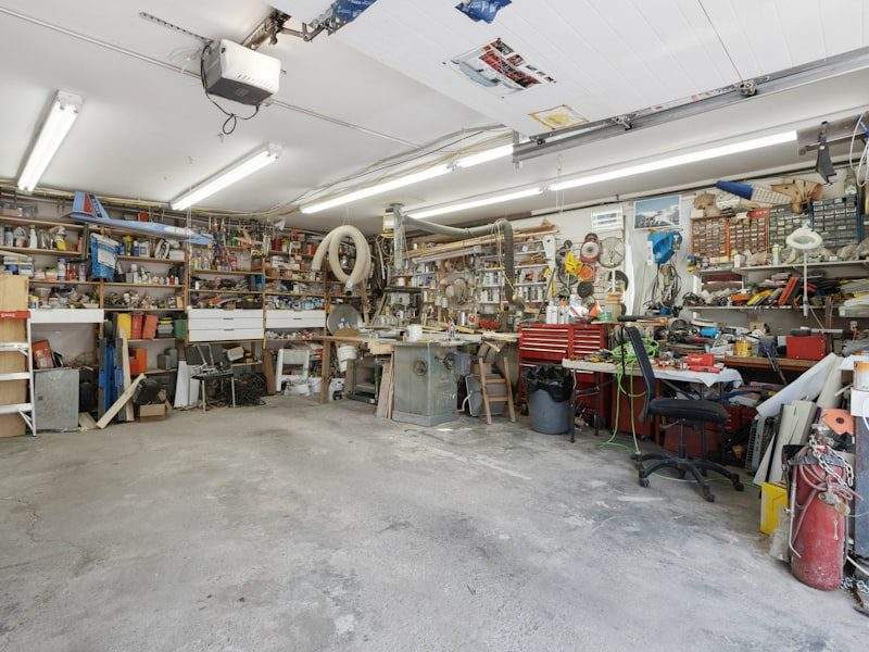 Cluttered garage before cleanout in Beverly Hills, CA